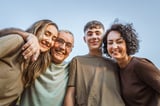 Portrait of family hugging together