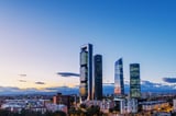 Cityscape of Madrid's financial district at dusk