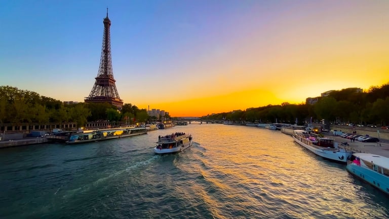 Eiffel Tower and boats on the Seine River at sunset in Paris