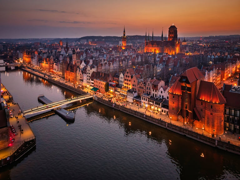 Beautiful old town of Gdansk with historic architecture over the Motlawa river at dusk