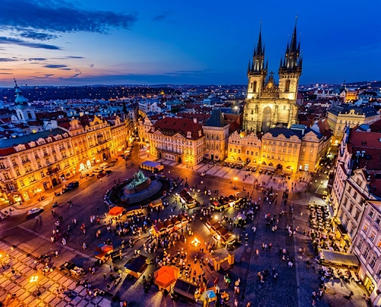 Aerial night view of Pragues Old Town Square with illuminated Church of Our Lady before Tyn and historic architecture