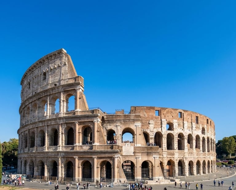 The Colosseum in Rome, an ancient Roman amphitheater with multiple arches and levels under a clear blue sky.